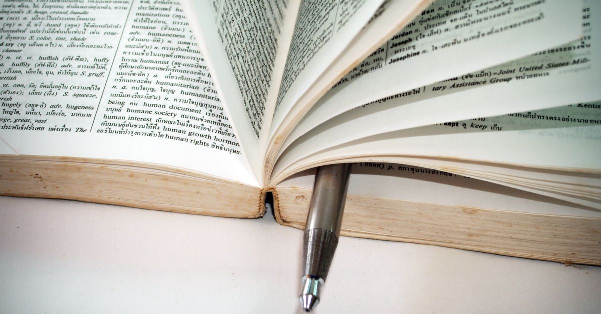 An open dictionary showing pages of word definitions