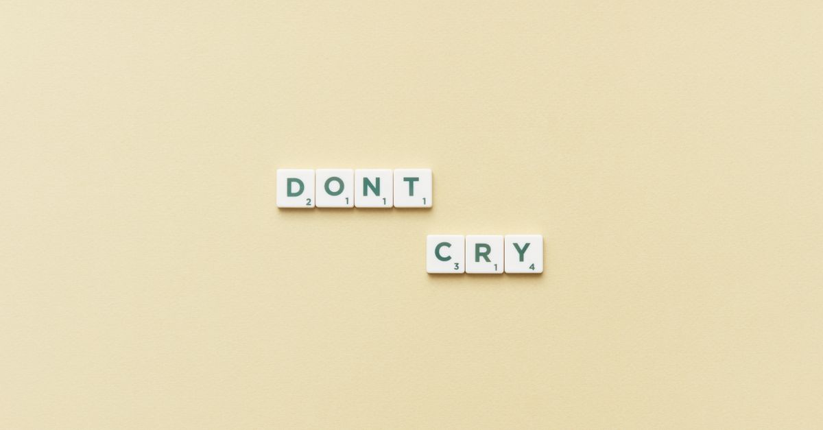 Scrabble tiles on a board showing point values